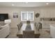 Dining room with seating for eight and adjacent to the kitchen at 5827 Mezzana Run, Palmetto, FL 34221