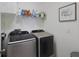 Laundry room with washer, dryer, and shelving at 5827 Mezzana Run, Palmetto, FL 34221