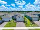 Two-car garage home with light grey and white exterior at 5827 Mezzana Run, Palmetto, FL 34221