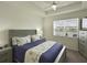 Bedroom with lake view and gray wood bed frame at 5827 Mezzana Run, Palmetto, FL 34221