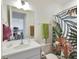 Clean bathroom with single vanity and shower/tub combo at 5827 Mezzana Run, Palmetto, FL 34221