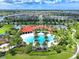 Aerial view showing expansive community pool and surrounding landscape at 5827 Mezzana Run, Palmetto, FL 34221