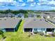Aerial view of community homes and lake at 5827 Mezzana Run, Palmetto, FL 34221
