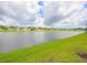 Peaceful lake view with homes along the shoreline at 5827 Mezzana Run, Palmetto, FL 34221