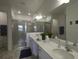 Elegant bathroom with double vanity and walk-in shower at 5827 Mezzana Run, Palmetto, FL 34221