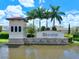 Community entrance sign at Trevesta with palm trees and water feature at 5827 Mezzana Run, Palmetto, FL 34221
