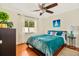 Bedroom with a full-size bed and plenty of natural light at 10268 Alexandria Ave, Englewood, FL 34224