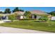 Single-story home with a two-car garage and well-manicured lawn at 10268 Alexandria Ave, Englewood, FL 34224