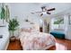 Guest bedroom with hardwood floors, and adjacent bathroom at 10268 Alexandria Ave, Englewood, FL 34224