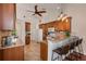Kitchen with an island and breakfast bar, perfect for entertaining at 10268 Alexandria Ave, Englewood, FL 34224