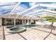 Large pool and spa with a covered patio and lounge chairs at 10268 Alexandria Ave, Englewood, FL 34224