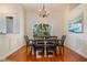 Elegant dining room with hardwood floors and a chandelier at 10268 Alexandria Ave, Englewood, FL 34224