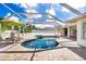 Relaxing pool and spa area with a covered patio at 10268 Alexandria Ave, Englewood, FL 34224