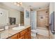 Bathroom with tub, shower, granite vanity, and tile flooring at 10268 Alexandria Ave, Englewood, FL 34224