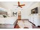 Main bedroom with hardwood floors and ensuite bathroom access at 10268 Alexandria Ave, Englewood, FL 34224
