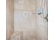 Large walk-in shower with built-in bench and tiled walls at 10268 Alexandria Ave, Englewood, FL 34224