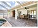 Spacious patio with outdoor dining set and pool access at 10268 Alexandria Ave, Englewood, FL 34224