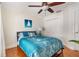 Bedroom with a full-size bed, wood floors, and a large closet at 10268 Alexandria Ave, Englewood, FL 34224