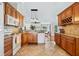 Spacious kitchen with wood cabinets, granite counters, and stainless steel appliances at 10268 Alexandria Ave, Englewood, FL 34224