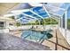 Inviting screened pool and spa with patio area at 10268 Alexandria Ave, Englewood, FL 34224