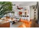 Open living area with hardwood floors, a wooden coffee table, and kitchen views at 10268 Alexandria Ave, Englewood, FL 34224