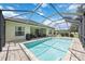 Large screened pool and patio with plenty of space for relaxation at 164 Avens Dr, Nokomis, FL 34275