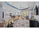 Tan leather furniture and hardwood floors accent this living room at 164 Avens Dr, Nokomis, FL 34275