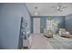 Home office with two armchairs, a desk and a ceiling fan at 164 Avens Dr, Nokomis, FL 34275