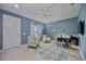 Bright home office space with ceiling fan and hardwood floors at 164 Avens Dr, Nokomis, FL 34275