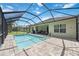 Relax by the refreshing screened pool and spacious patio at 164 Avens Dr, Nokomis, FL 34275