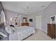 Serene bedroom with ensuite access, neutral decor, and natural light at 164 Avens Dr, Nokomis, FL 34275