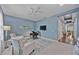 Home office with two armchairs, a desk, and a view into the living area at 164 Avens Dr, Nokomis, FL 34275