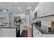 Modern kitchen with white cabinets and granite countertops at 164 Avens Dr, Nokomis, FL 34275