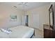 Bedroom with a queen bed, dresser, and access to bathroom at 164 Avens Dr, Nokomis, FL 34275