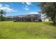 Large backyard with a screened pool and patio at 164 Avens Dr, Nokomis, FL 34275