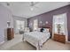 Bright bedroom featuring a comfortable bed, neutral decor, and natural light at 164 Avens Dr, Nokomis, FL 34275