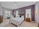 Spacious bedroom with a ceiling fan, large windows, and plenty of closet space at 164 Avens Dr, Nokomis, FL 34275