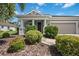 Single story home with attached garage and well-manicured landscaping at 164 Avens Dr, Nokomis, FL 34275