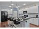 Modern kitchen with white cabinets and granite countertops at 164 Avens Dr, Nokomis, FL 34275