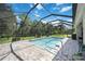 Enjoy the refreshing screened pool and expansive patio at 164 Avens Dr, Nokomis, FL 34275