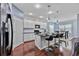 Modern kitchen with white cabinets, breakfast bar, and dark countertops at 164 Avens Dr, Nokomis, FL 34275