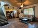 Living room with a sofa and coffee table, featuring high ceilings at 2631 Fiesta Dr, Venice, FL 34293