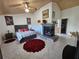 Main bedroom with fireplace, large bed, and ensuite bathroom at 2631 Fiesta Dr, Venice, FL 34293