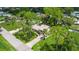 Aerial view of a home nestled among tall trees at 2631 Fiesta Dr, Venice, FL 34293