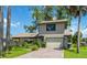 Two-story home with brick driveway and landscaping at 2631 Fiesta Dr, Venice, FL 34293