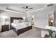 Bright and airy main bedroom with king bed and ensuite bathroom access at 16162 61St E Ln, Parrish, FL 34219