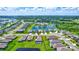Aerial view of house with pool in a quiet residential neighborhood at 16162 61St E Ln, Parrish, FL 34219
