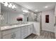 Double vanity bathroom with granite countertops and a large shower at 16162 61St E Ln, Parrish, FL 34219