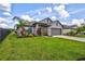 Single-Gathering home with gray exterior and two-car garage at 16162 61St E Ln, Parrish, FL 34219