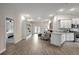 Open floorplan showing kitchen, living room, and bedroom with tile floors at 16162 61St E Ln, Parrish, FL 34219